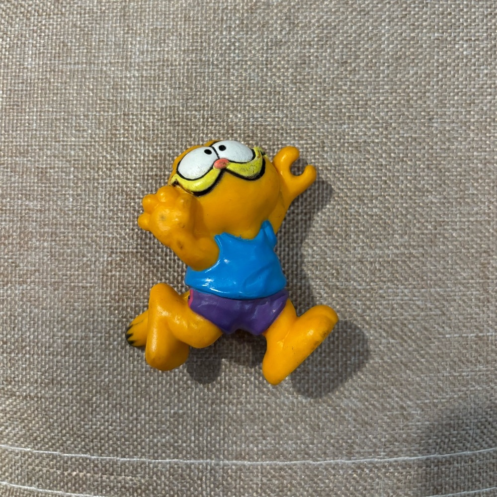 Garfield Cartoon Figure with Blue and Purple Outfit